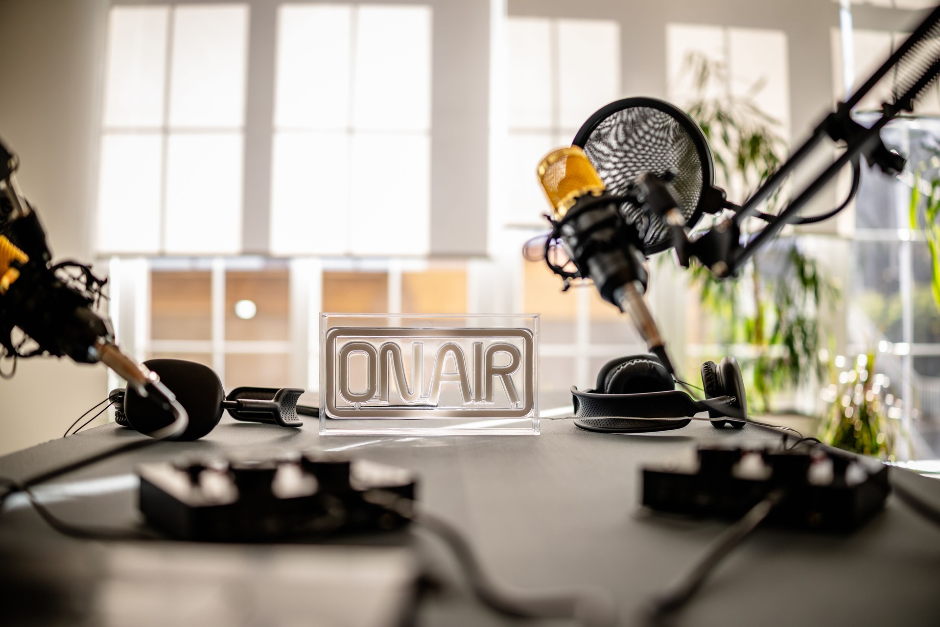 Podcast studio with professional equipment and joyful atmosphere for lively discussions and interviews